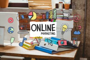 biurko z rzeczami biurowymi, grafiki online marketing